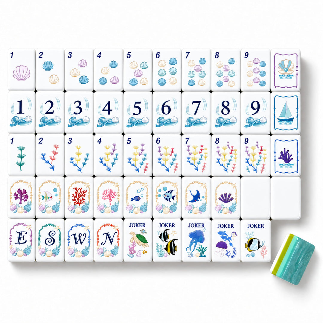 Large size Coastal Ocean American Mahjong tile set from the Artistry Collection by The Mahjong Tile, featuring seashell dots, sailboat bams, coral craks, marine life jokers, and blue-green acrylic backs.