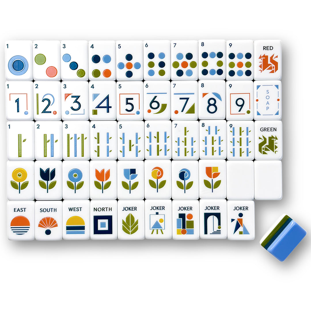 Geometric American Mahjong tile set from the Artistry Collection by The Mahjong Tile, featuring modern minimalist geometric engravings, sleek number fonts, and blue-green acrylic tile backs.