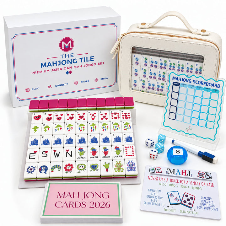 Complete 8-piece gift bundle and packaging details for the Heart Mahjong Tile Set from the Artistry Collection by The Mahjong Tile, including carrying case, retail box, scoreboards, dice, and reading cards.