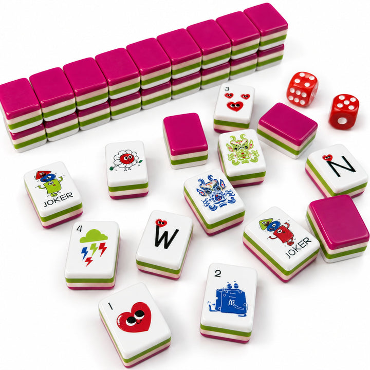 Stacked and scattered tiles of the Heart American Mahjong set from the Artistry Collection by The Mahjong Tile, showing pink-backed layers, unique character illustrations, and red dice.