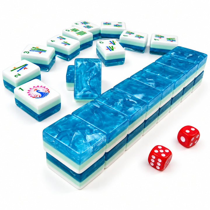 Close-up details of Ocean Blue acrylic Mahjong tiles by The Mahjong Tile, highlighting the shimmering blue ocean-wave back pattern, multi-layer design, and red dice.